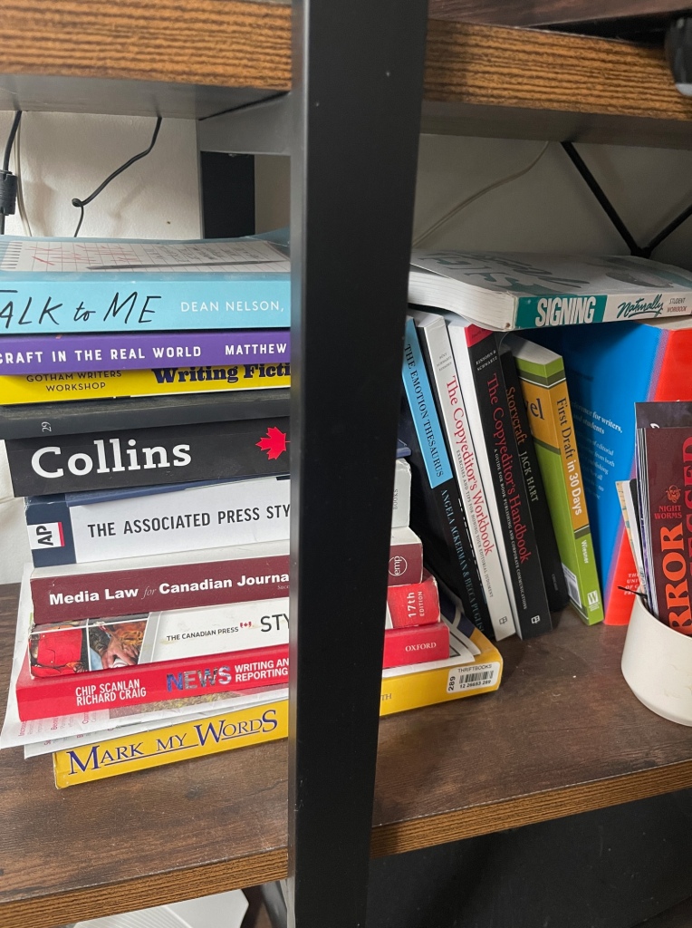 Assorted books on a shelf.